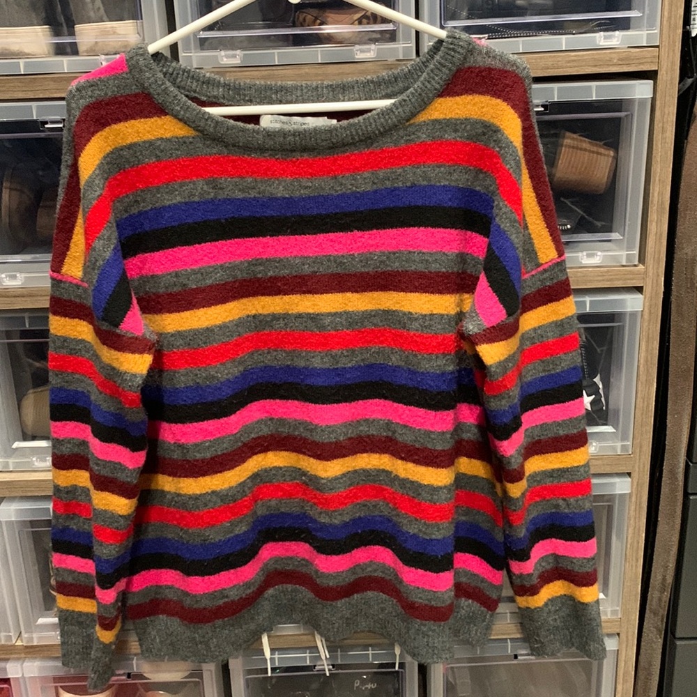 Stitches and stripes sweater. Lots of bright stripes Size S but fits like a M/L